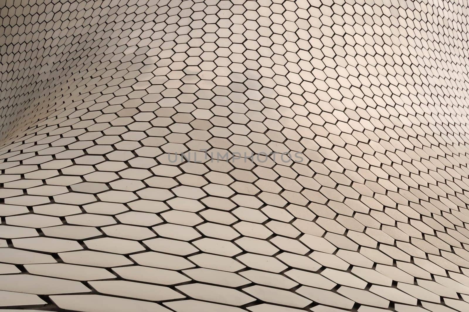 Close up on the metal hexagons forming the facade of the famous Soumaya Museum, Mexico City 2022