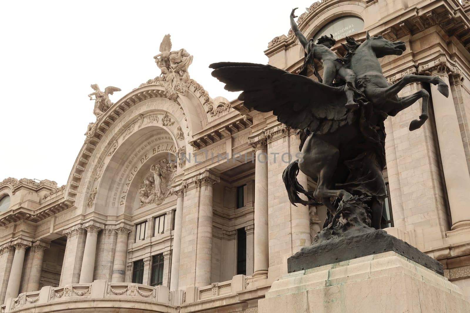 The balcony on the facade of the Palacio de Bellas artes/the Palace of fine arts and one of the Pegasus Statues next to it, Mexico City 2022