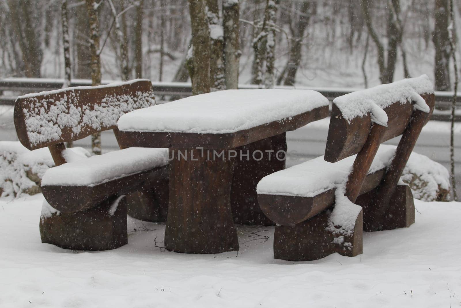 A resting place for hikers covered with fresh snow
