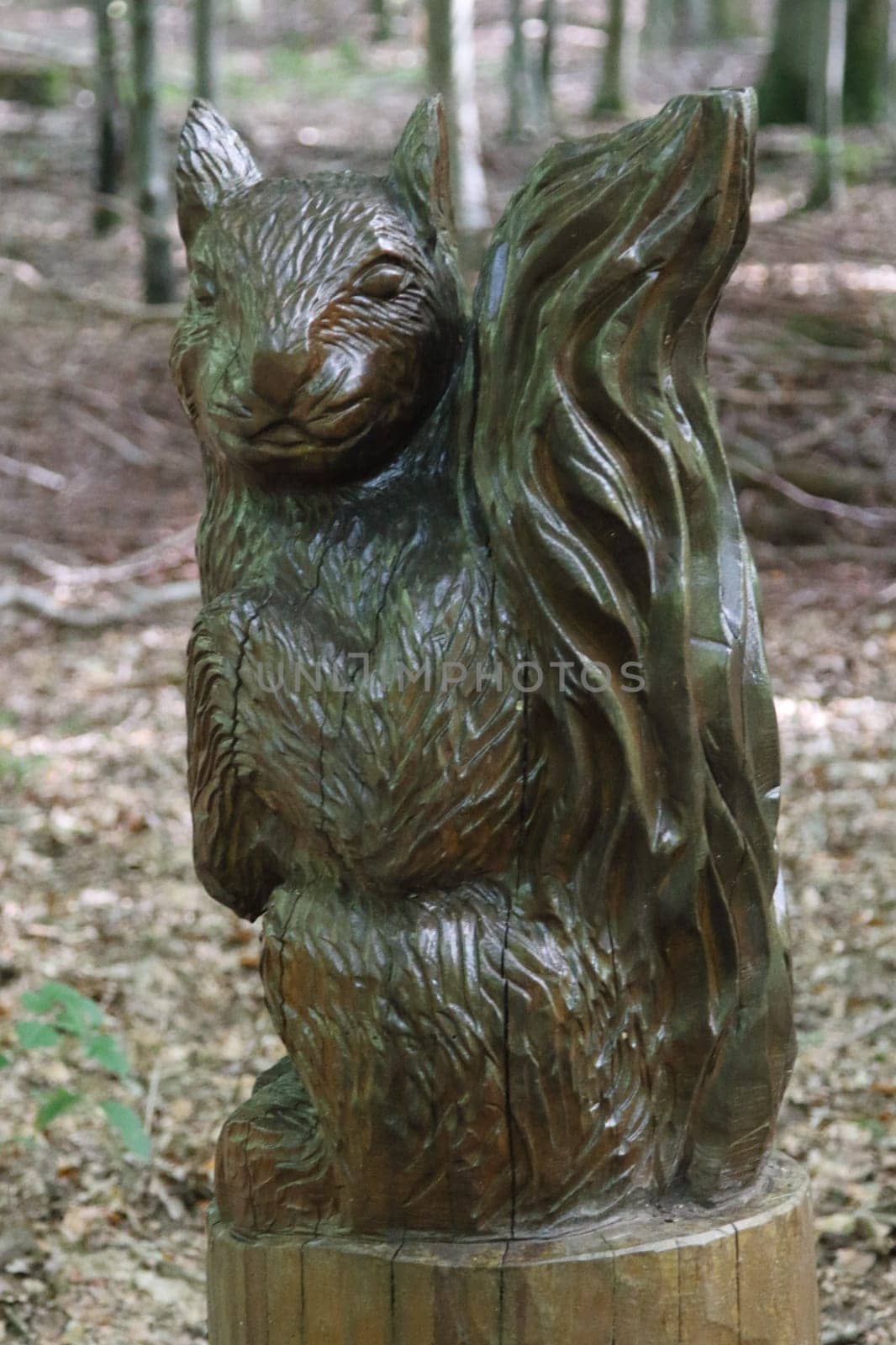 A squirrel carved from a tree trunk, mammal