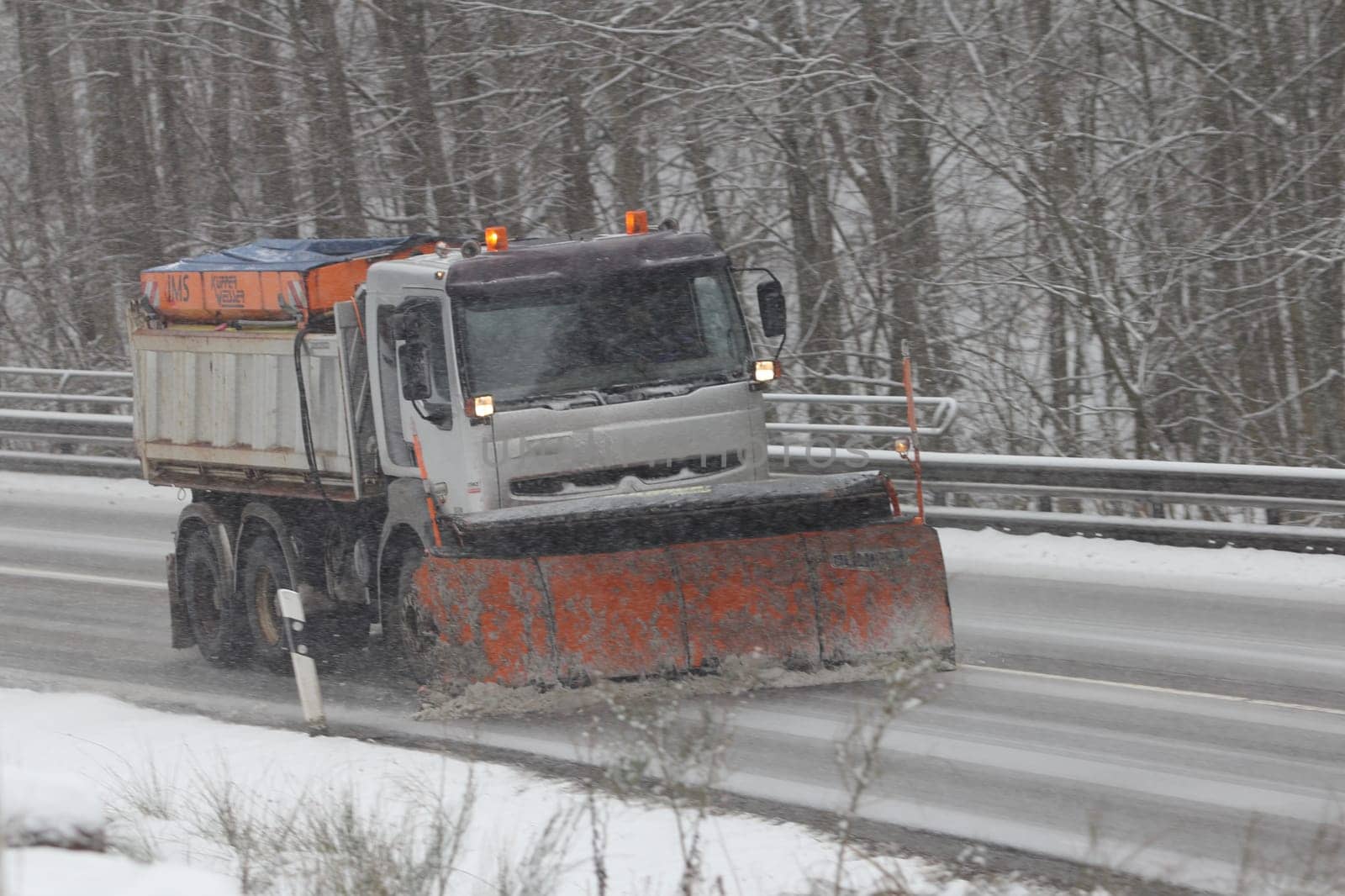 Birkenfeld, Germany February 6, 2018: A Winter service vehicle in use in heavy snow-fall