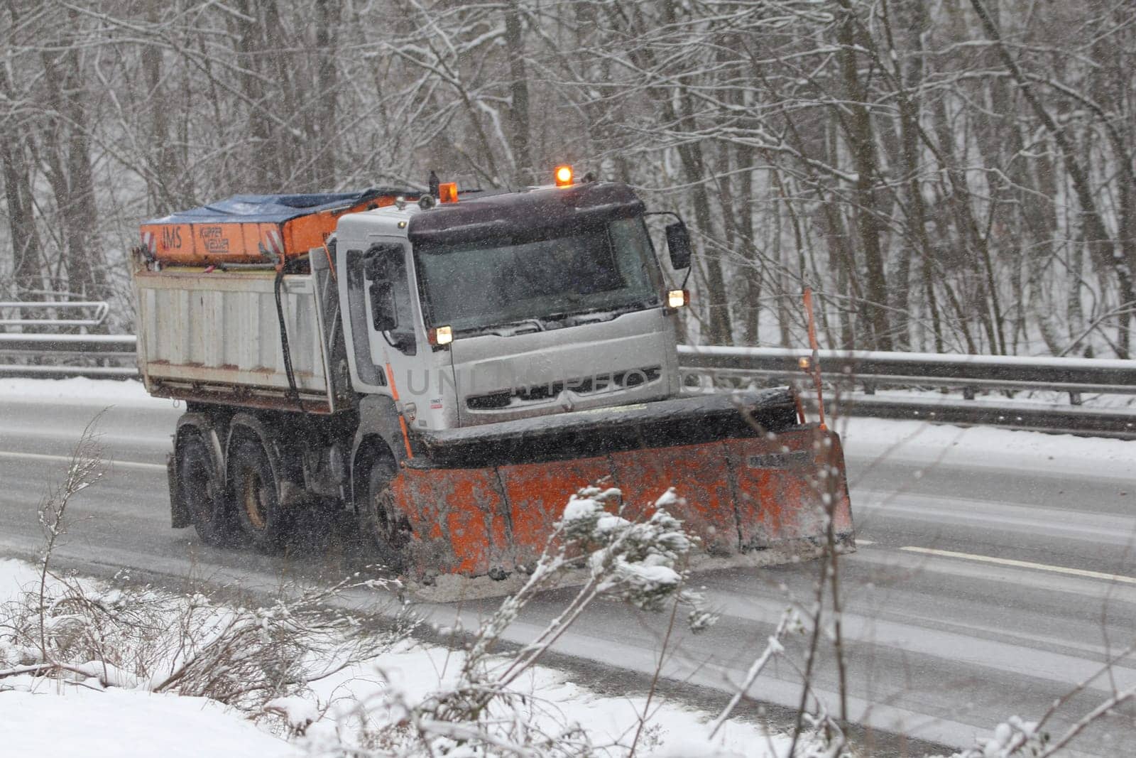 Birkenfeld, Germany February 6, 2018: A Winter service vehicle in use in heavy snow-fall
