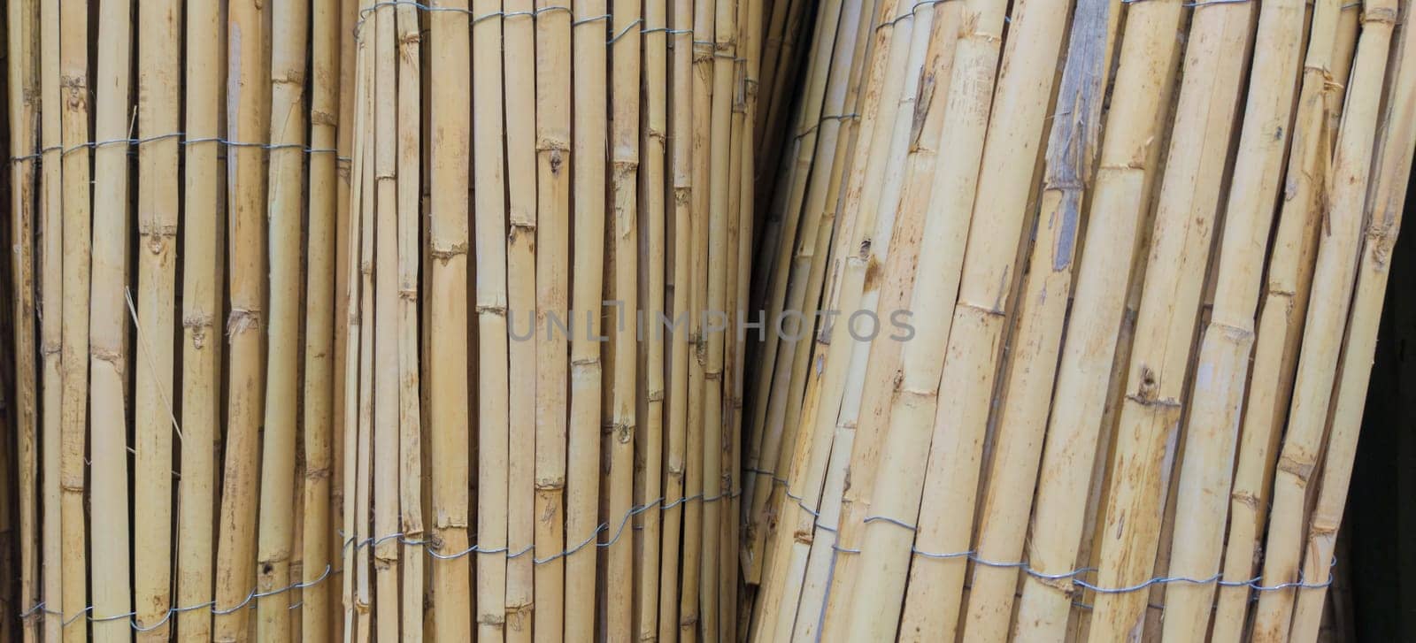 Garden fence rolls built with wattle. Selective focus