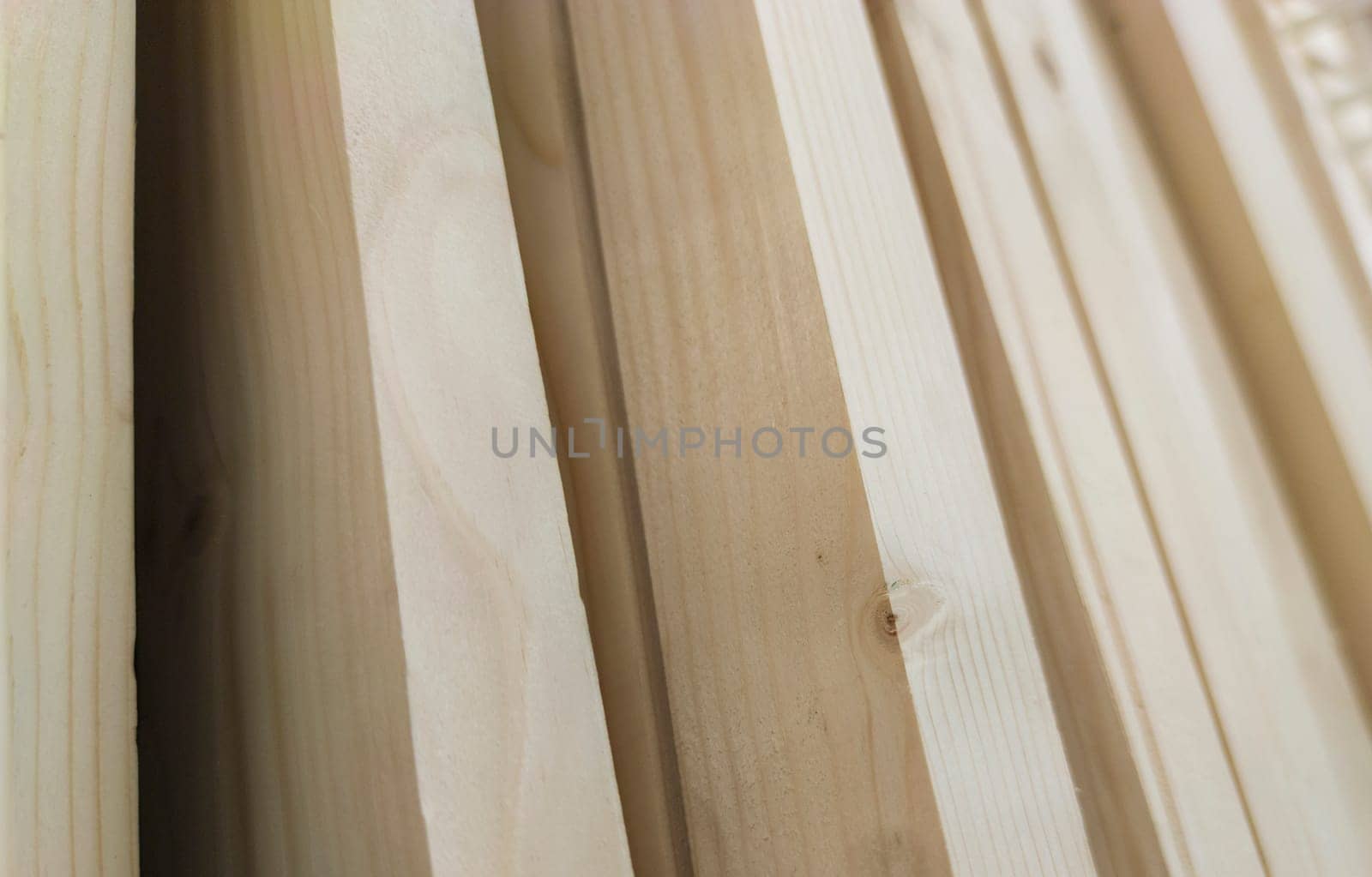 Planed strips made of fir tree wood. Selective focus