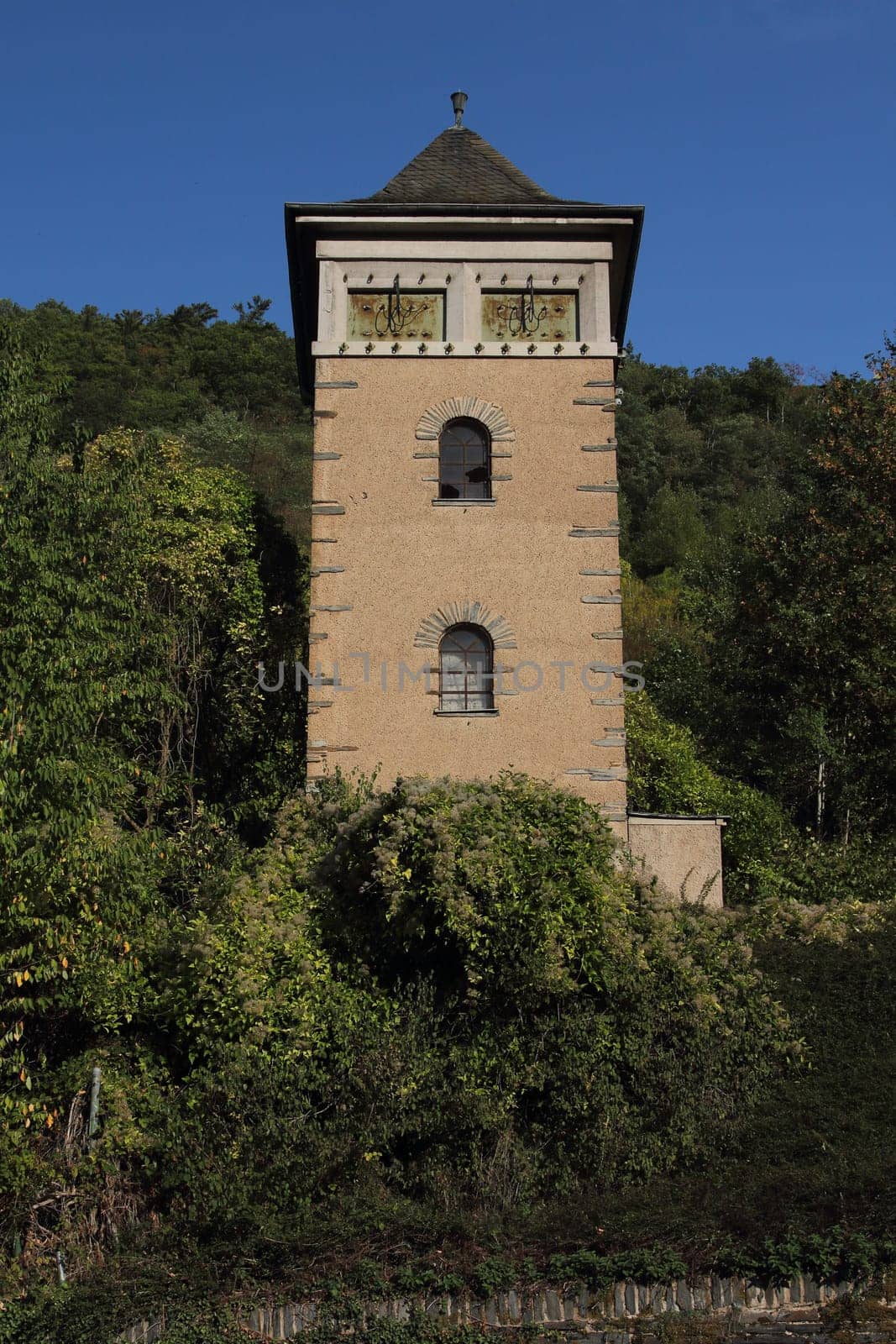 An old substation with clipped power cables, blue sky in background