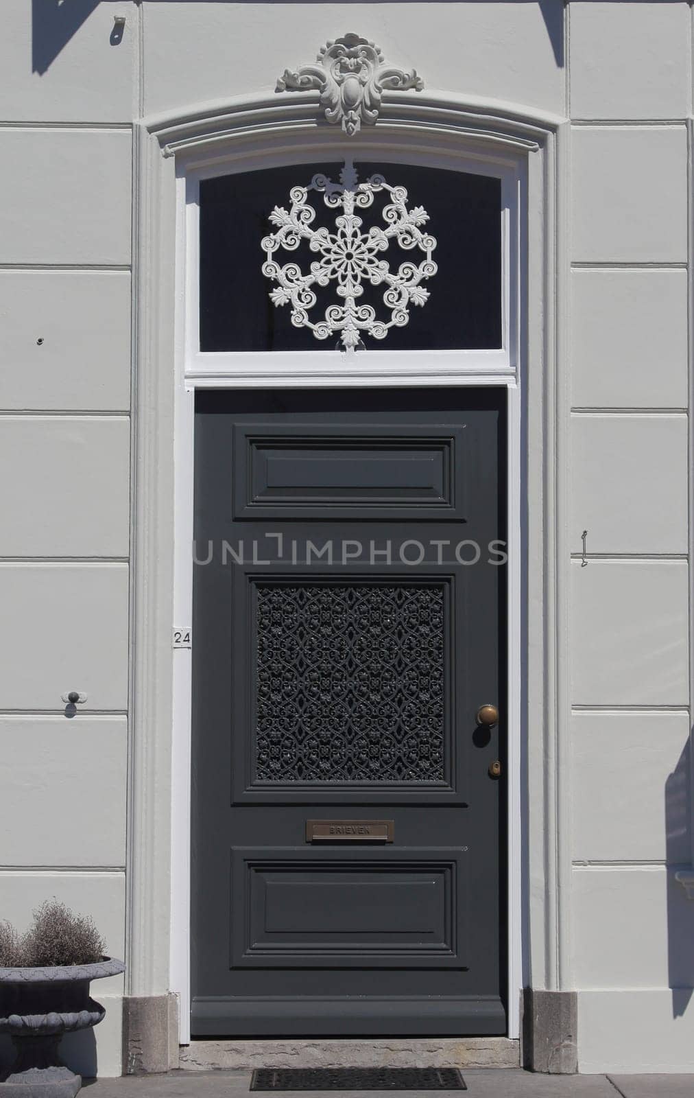 an old, beautifully decorated front door black and white