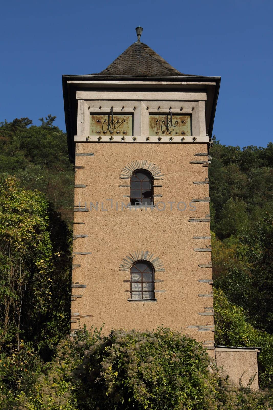 An old substation with clipped power cables, blue sky in background