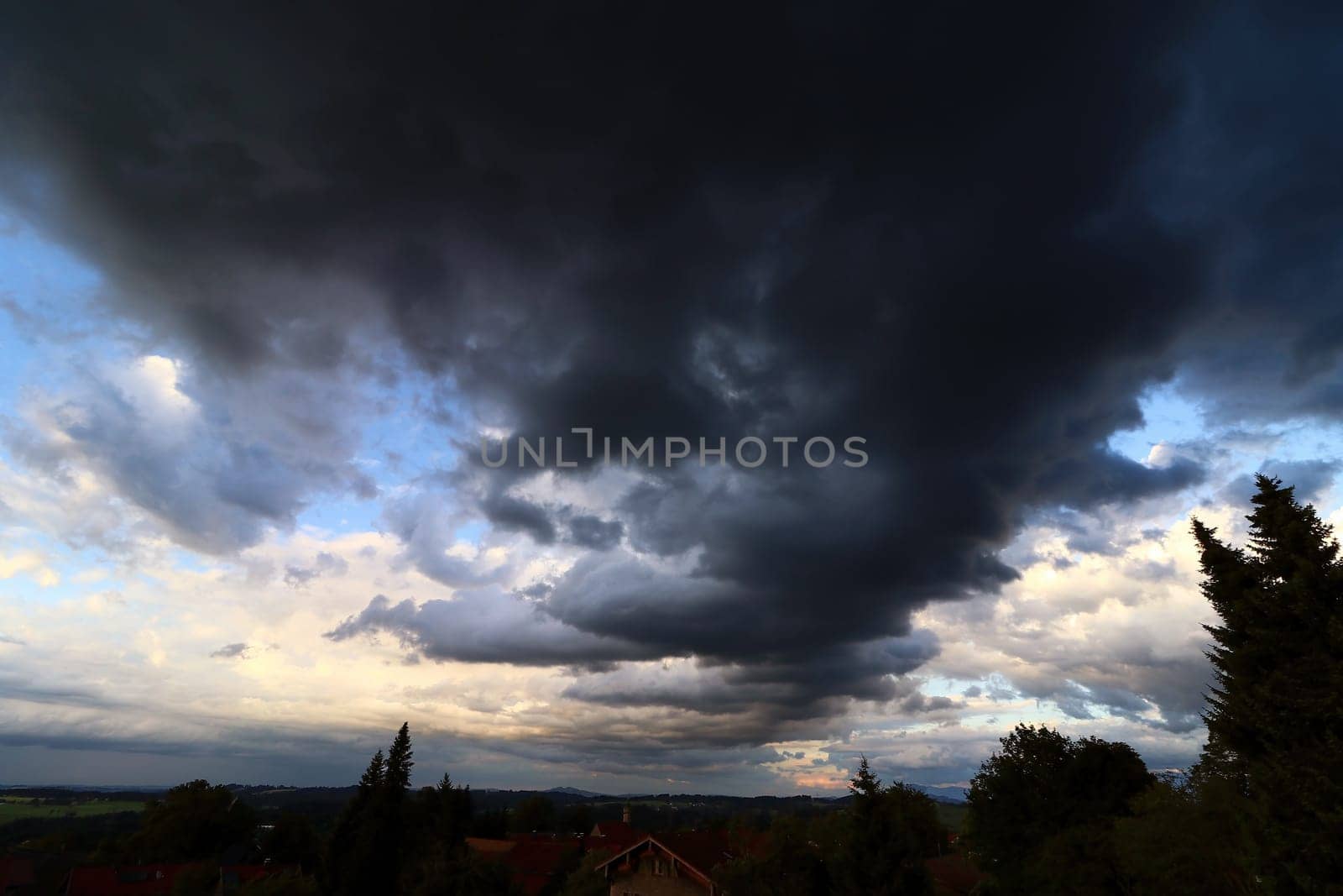 Dark, eerie rain clouds in the evening sky