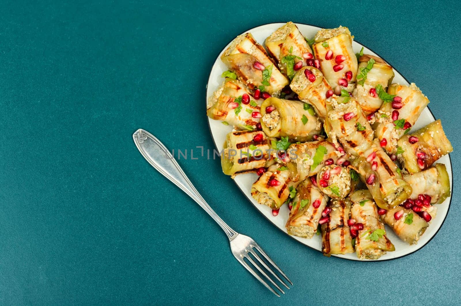 Badrijani, Vegan vegetarian healthy food. Grilled eggplant rolls on the table.