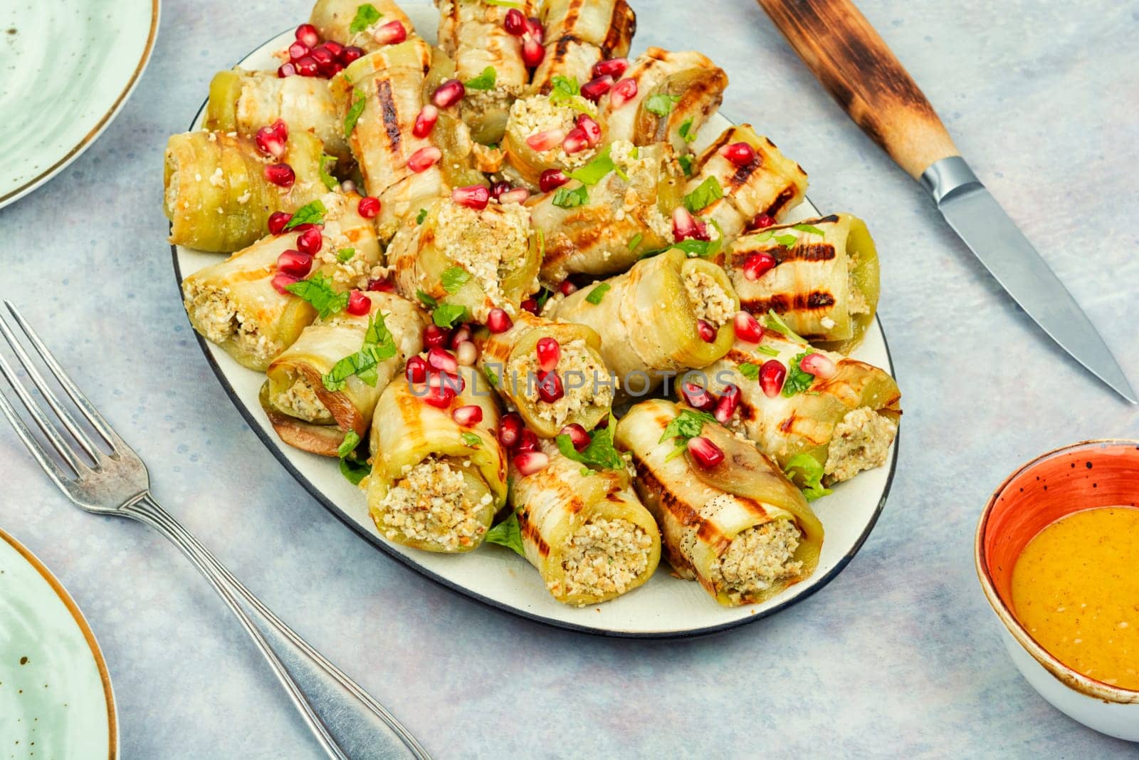 Badrijani, Vegan vegetarian healthy food. Grilled eggplant rolls on the table.