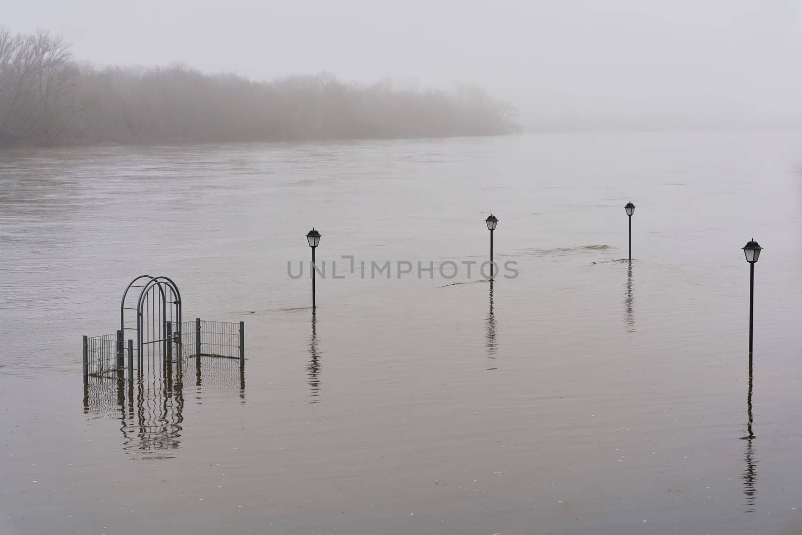 Flooded beer garden of an excursion restaurant on the Elbe near Magdeburg in Germany in January 2024 in rainy weather