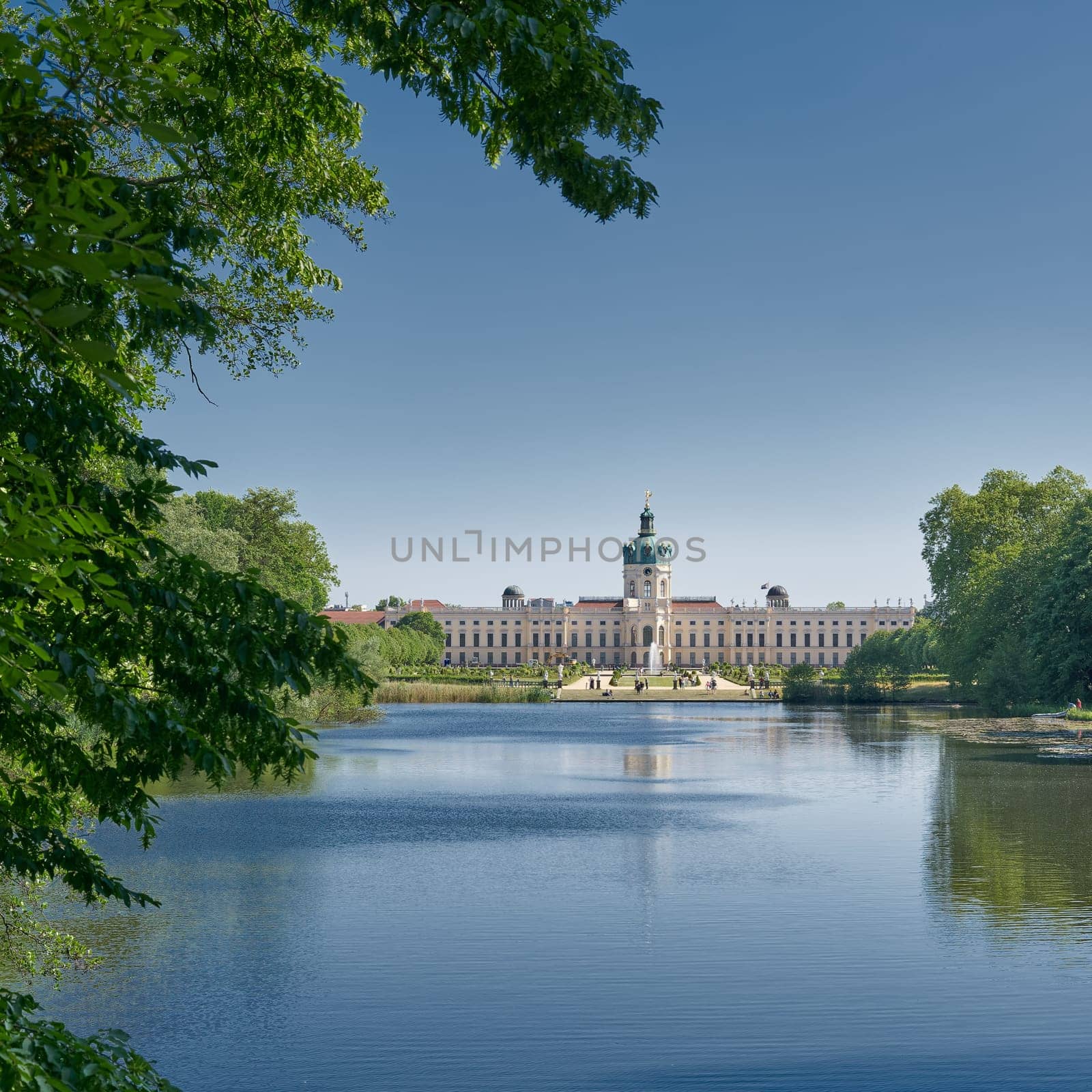 Charlottenburg Palace in Berlin seen from a public footpath by the carp pond