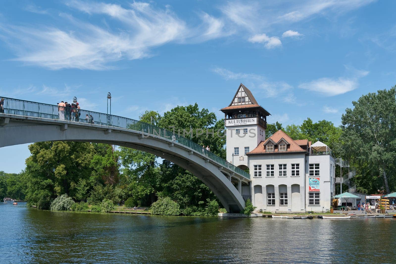 Berlin, Germany – June 03, 2023: Abteibrücke, Abbey Bridge to the Kulturhaus Insel, a popular venue in the middle of the River Spree in Berlin's Treptow district