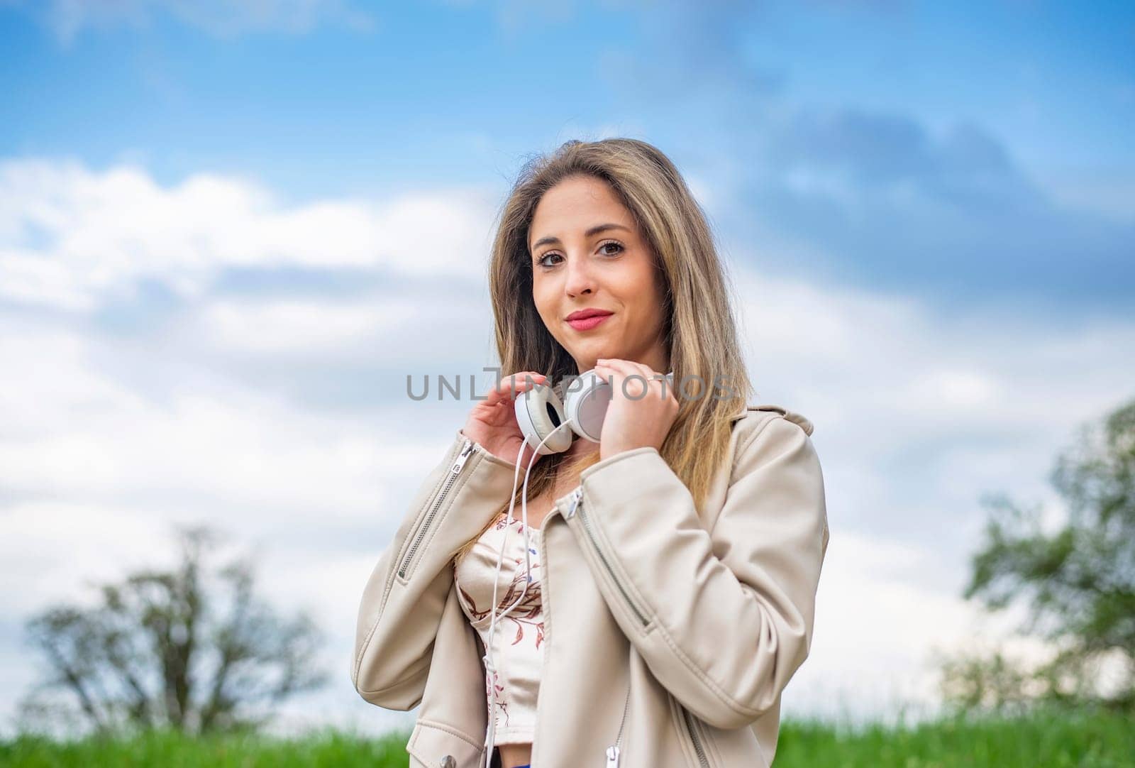 young woman listening music with headphones