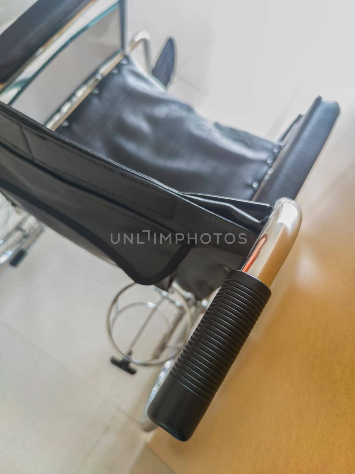 Conventional manual wheelchair taken with natural light. Selective focus