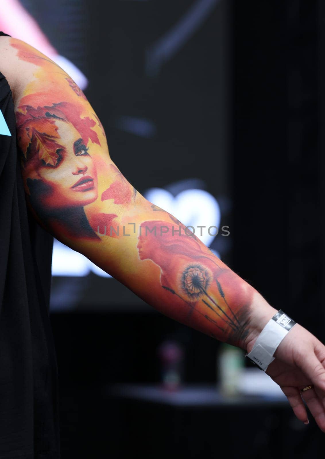 Krakow, Poland - June 12, 2022: Unidentified participant during the contest for the best tattoo at the 15th Tattoofest Convention in Cracow. One of the most prestigious tattoo festivals.