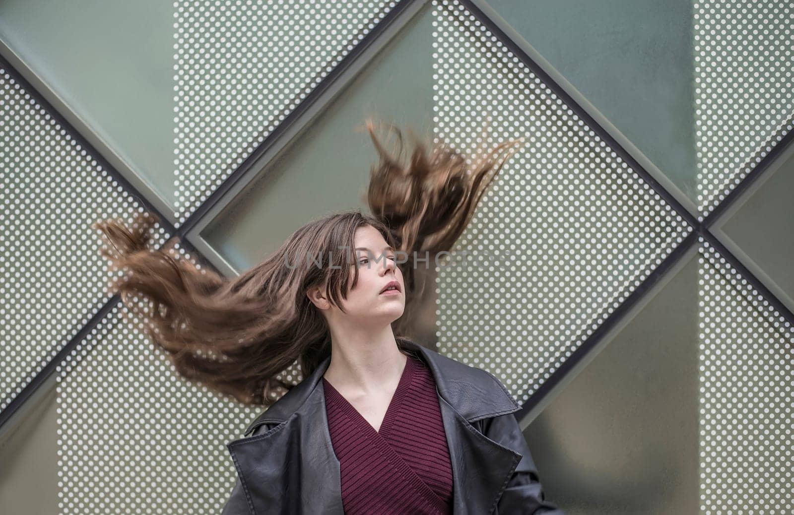 confident young woman with blowing hairs