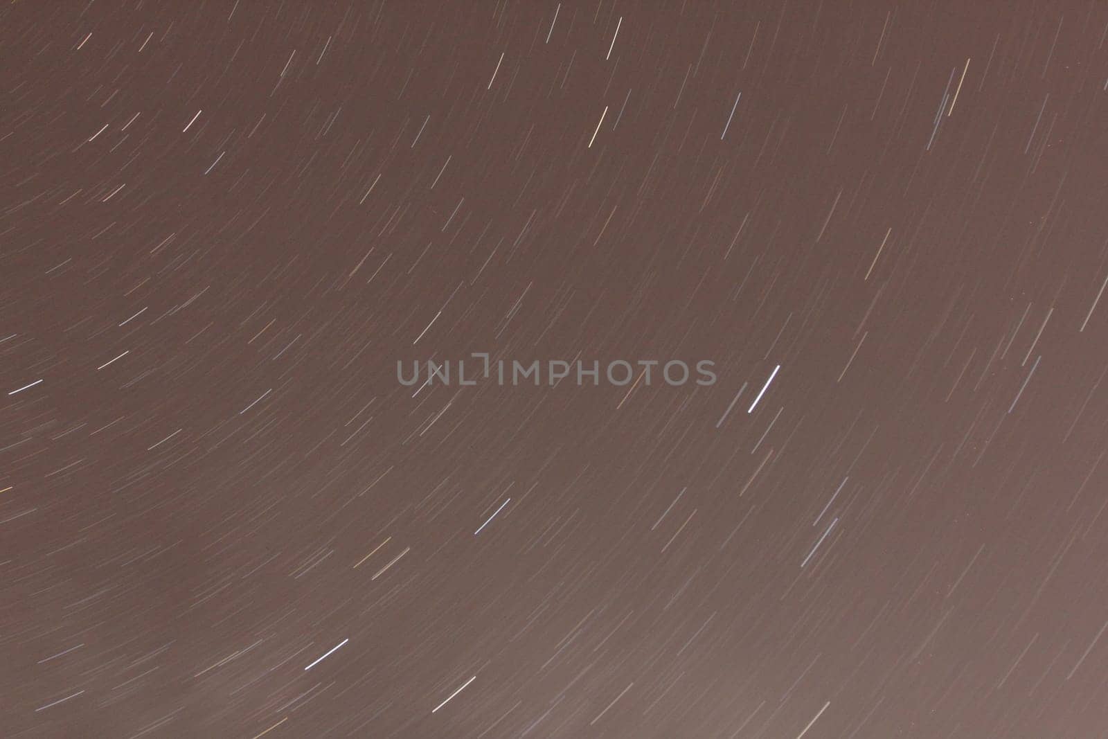 Stars move across the night sky, photographed with long exposure