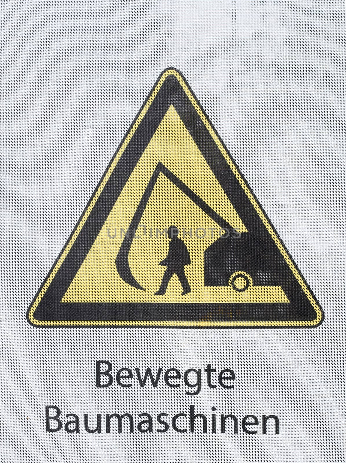 Yellow warning sign for moving construction machinery, Germany