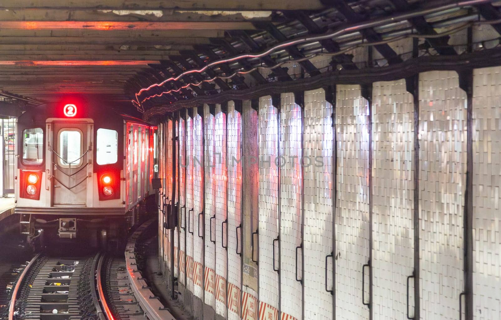 train arrives in the underground station in New York