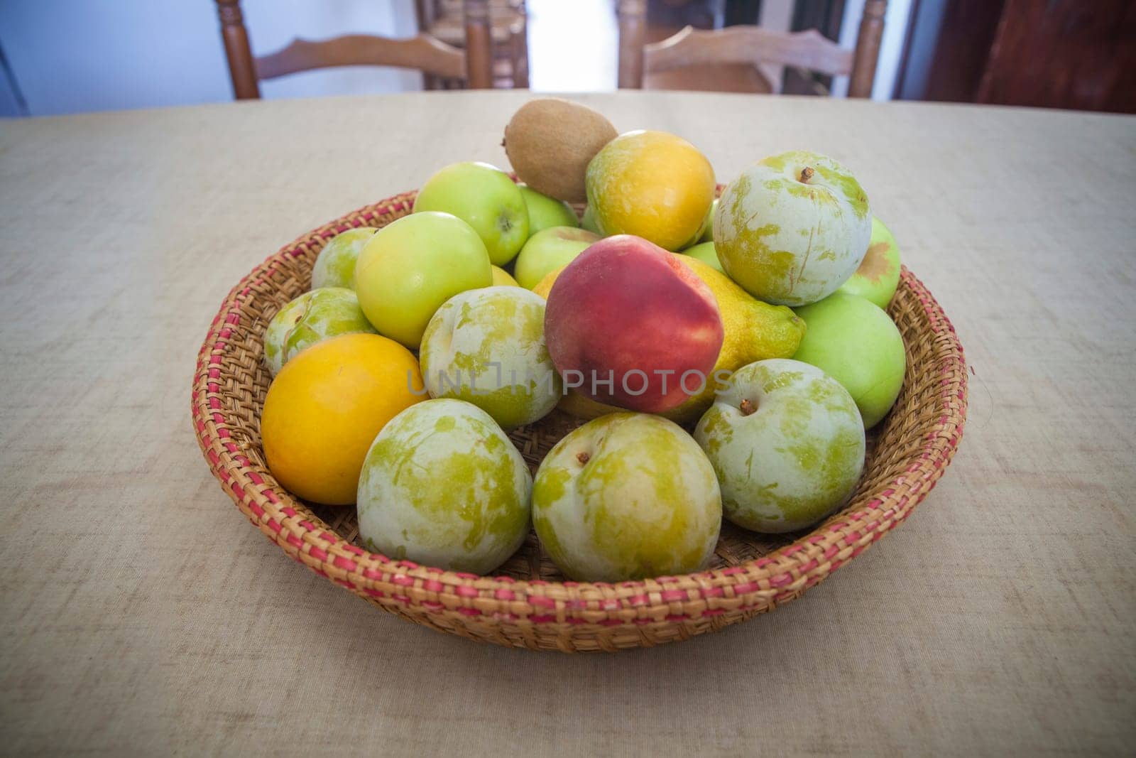 Basket plenty of seasonal fruit. Seasonal eating concept