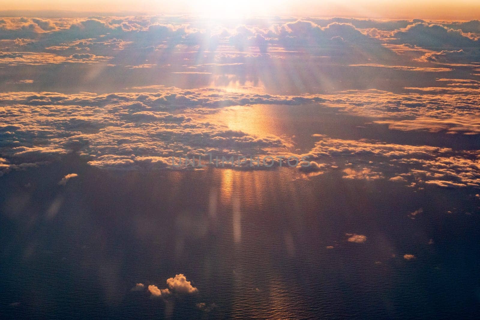 harmonic background in golden sunset with scenic ocean wiew and bright golden clouds