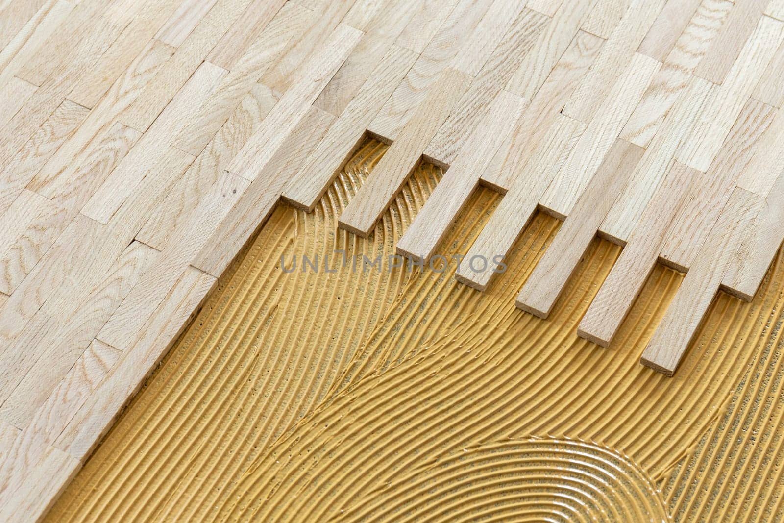 pattern of glue for fixing the parquet at the construction site