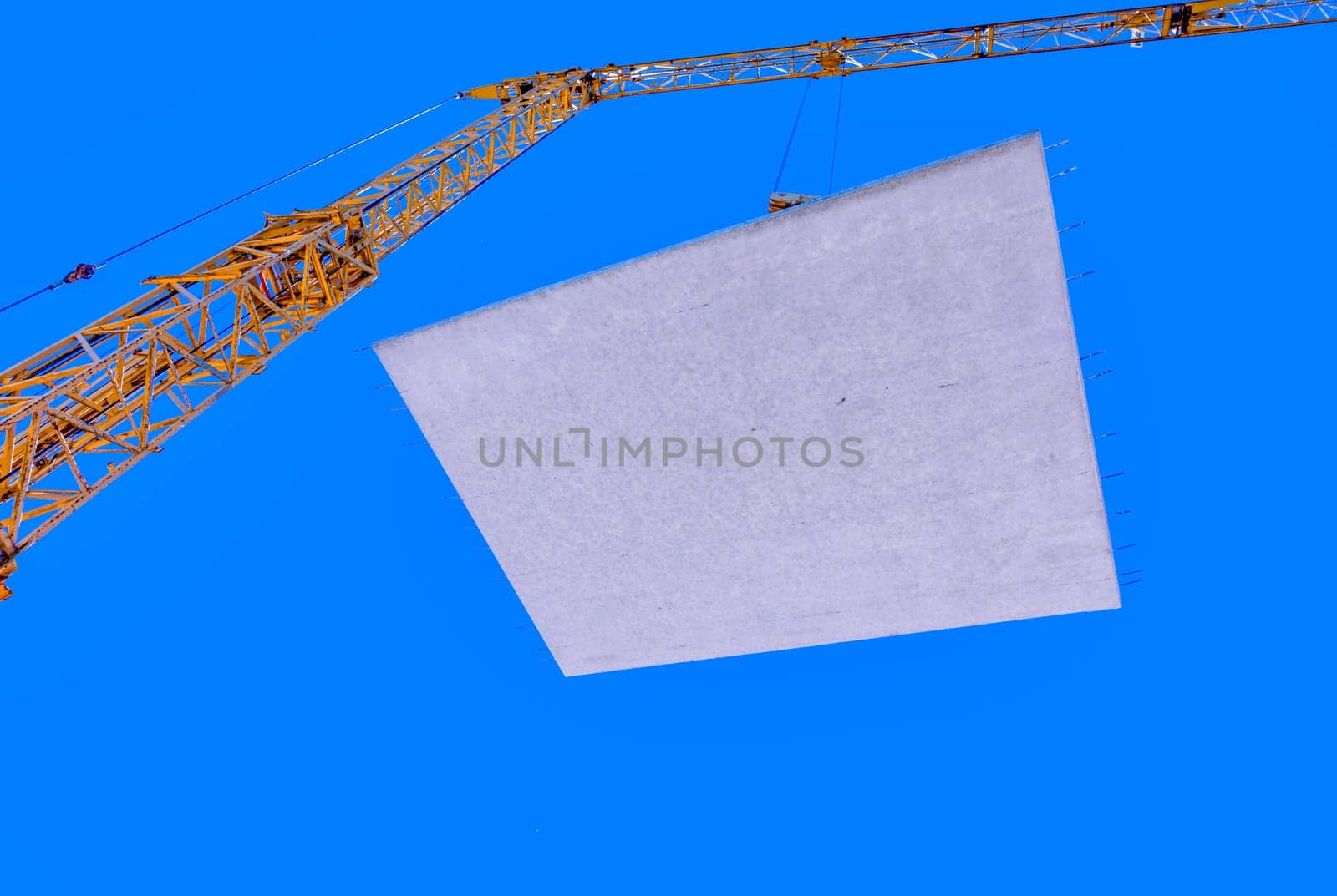 waterproof cocrete wall on a hook of a crane at the construction site in Germany