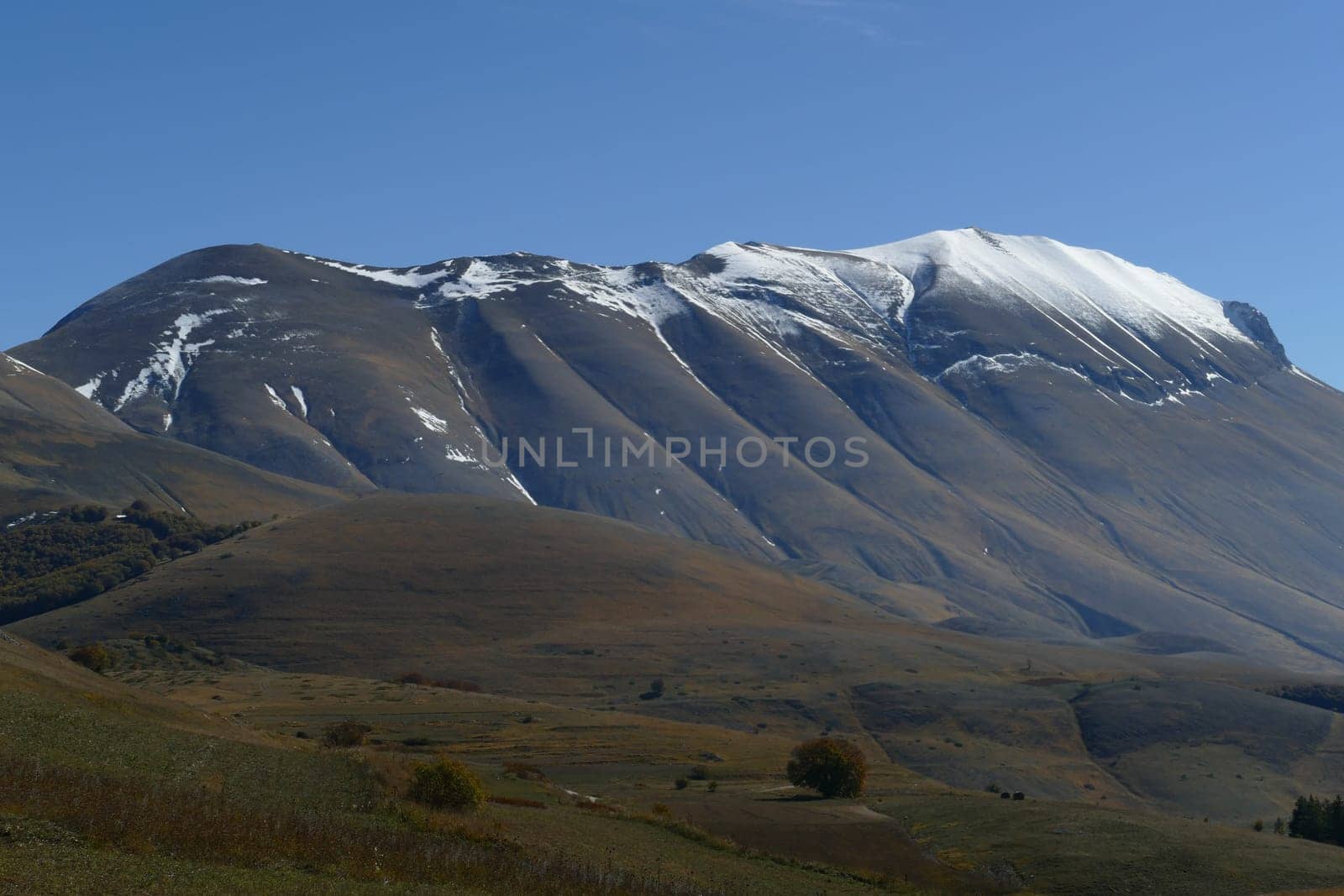 National park of the sibillini mountains. fields in castelluccio di norcia, umbria, italy