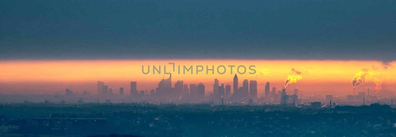 sunrise of skyline in Frankfurt, Germany with dark clouds