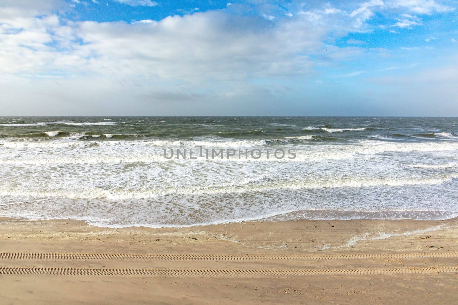 scenic landscape in Sylt with ocean, dune and empty beach in spring time