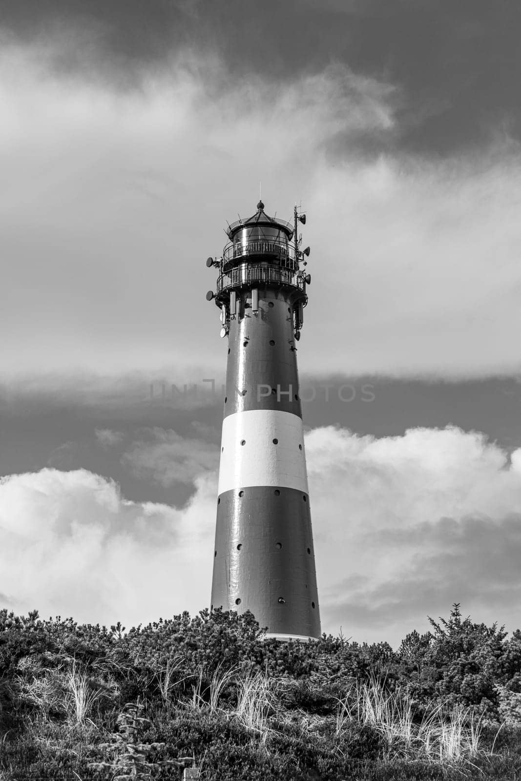 lighthouse of Hoernum on Sylt island, Germany. Landmark, tourist attraction and guiding light for navigation on the North Sea.