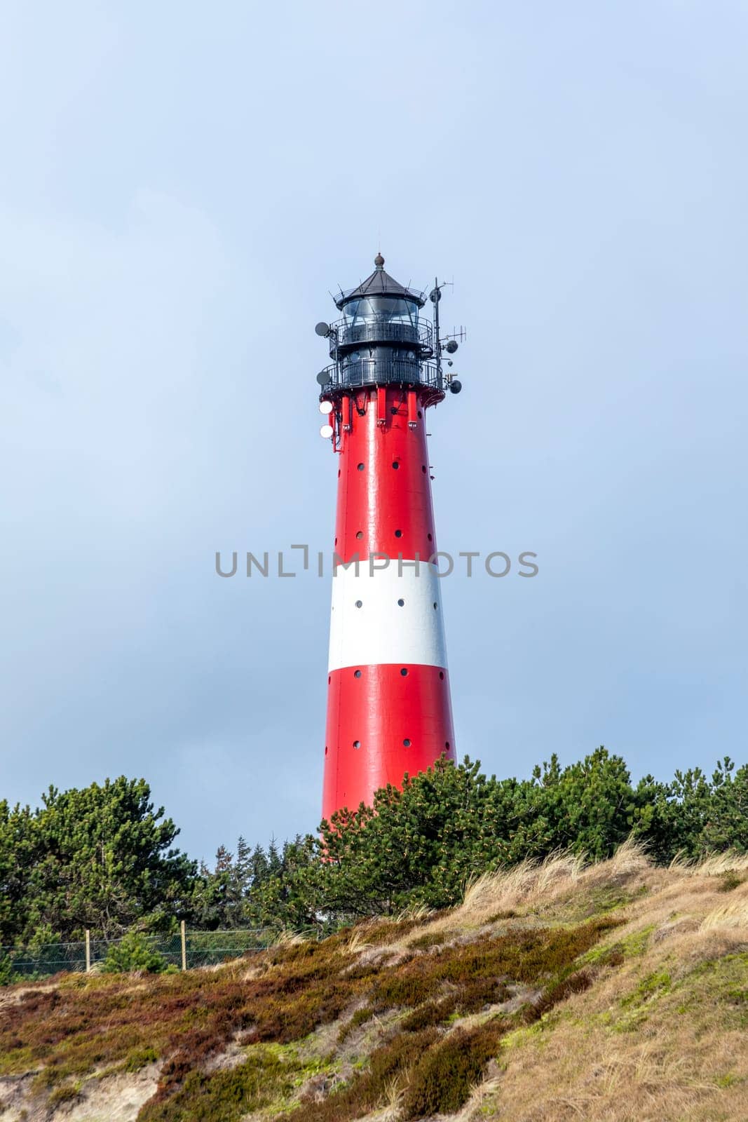 lighthouse of Hoernum on Sylt island, Germany. Landmark, tourist attraction and guiding light for navigation on the North Sea.