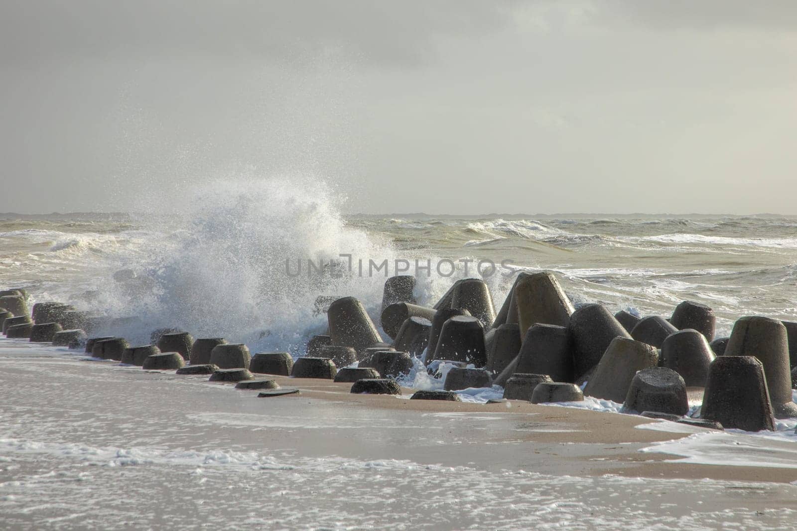wind breaker at the coast in Sylt in bad weather storm, Hoernum
