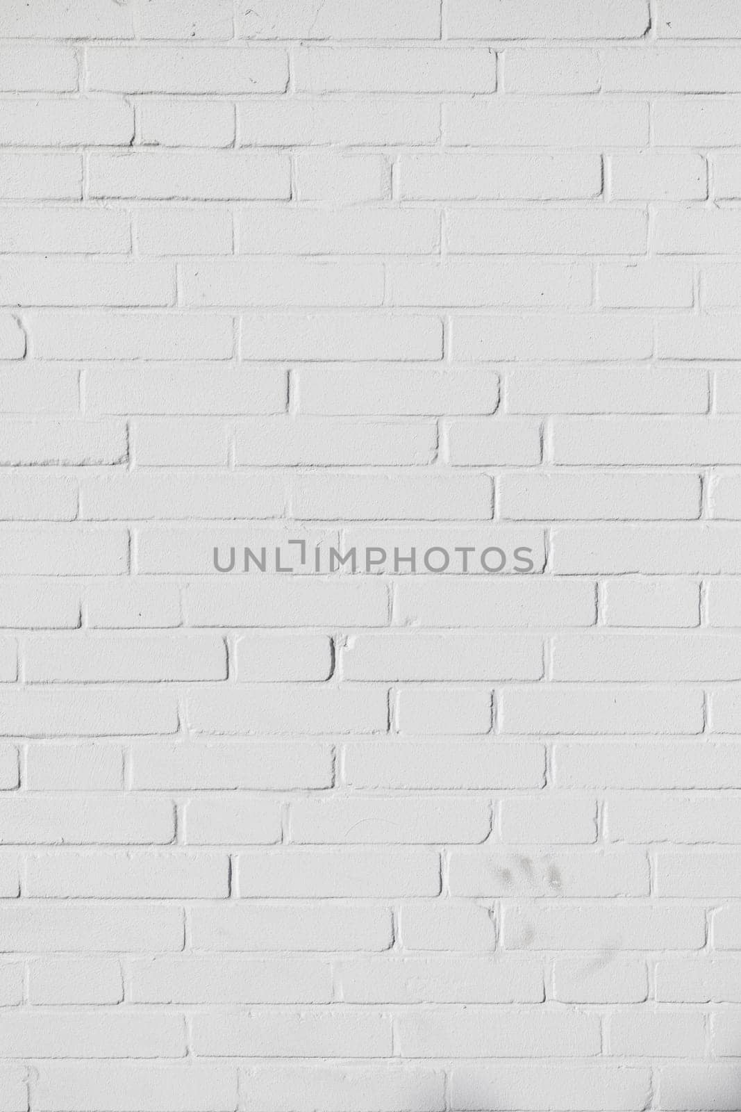 harmonic pattern of white painted brick wall