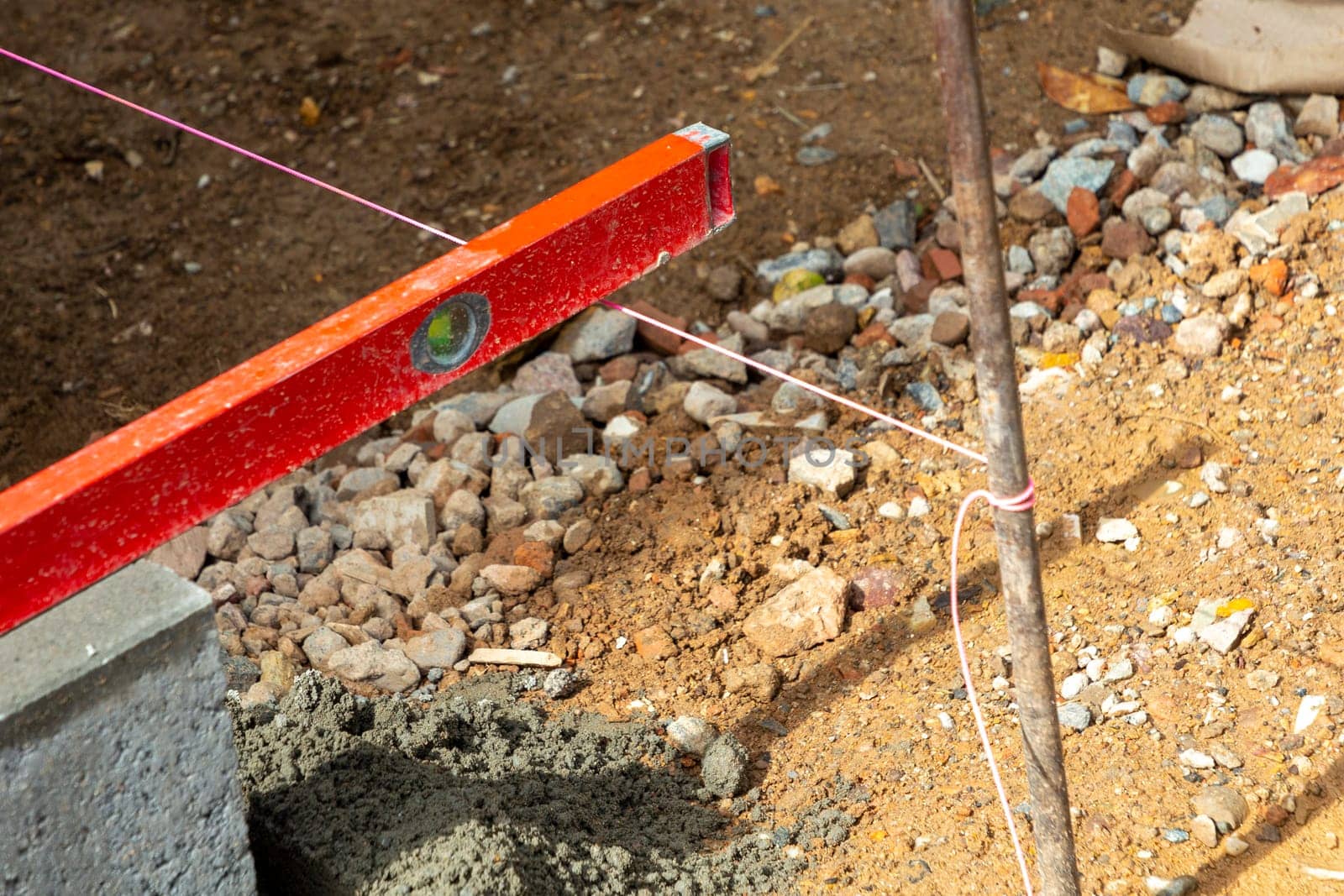 accurate measurement with spirit level to install the curbs in detail