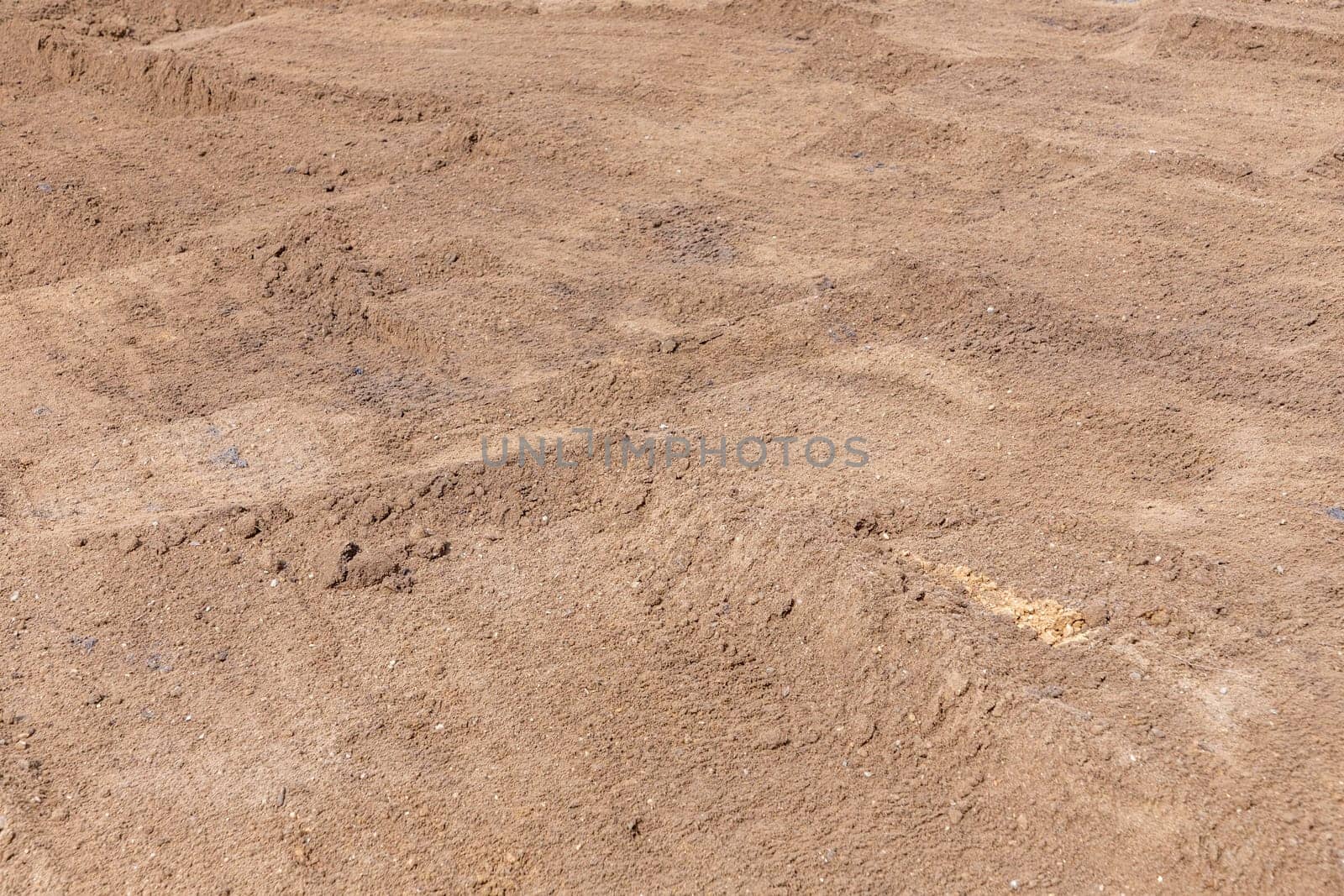pattern of fresh potting soil for laying a new lawn with green grass