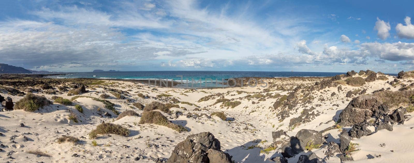 sandy beach in the north of Lanzarote near fisher village Orzola, Spain