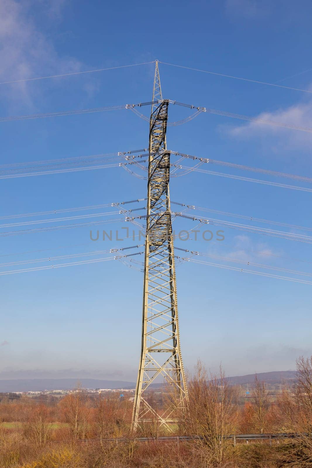 electric pylon  in Germany under blue sky