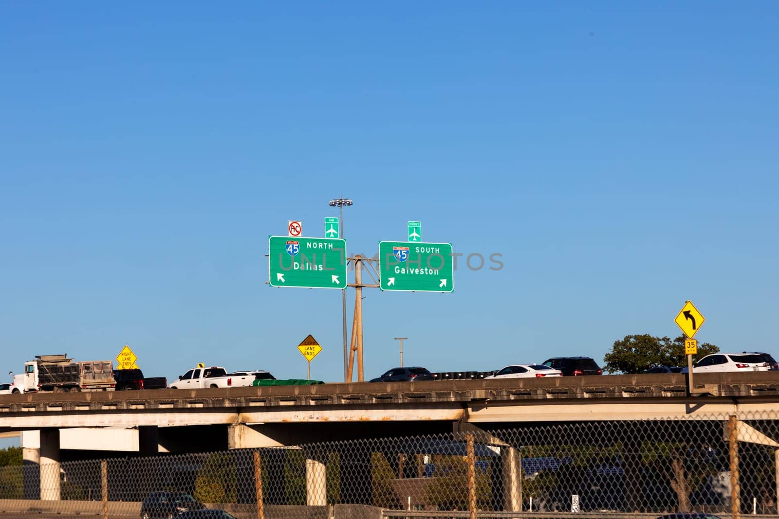 highway 45 with direction signage Dallas and Galveston under blue sky
