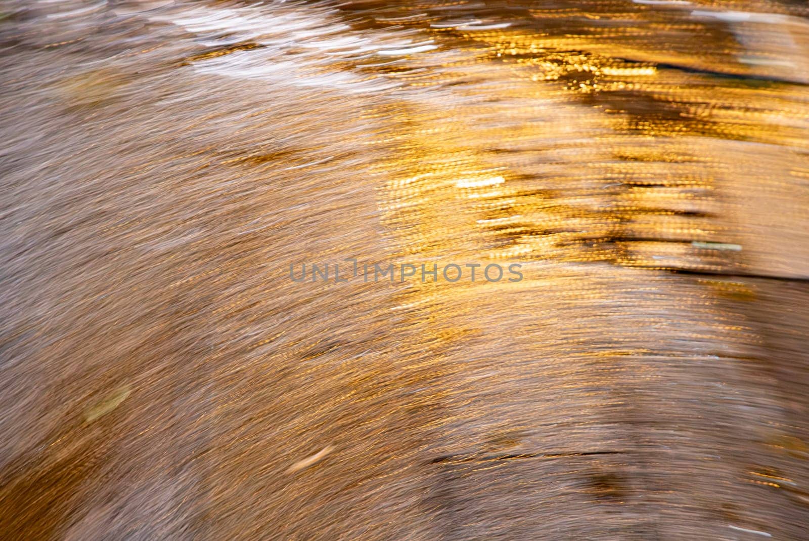 abstract of harmonic background symbolizing speed with curvy lines in different orange light