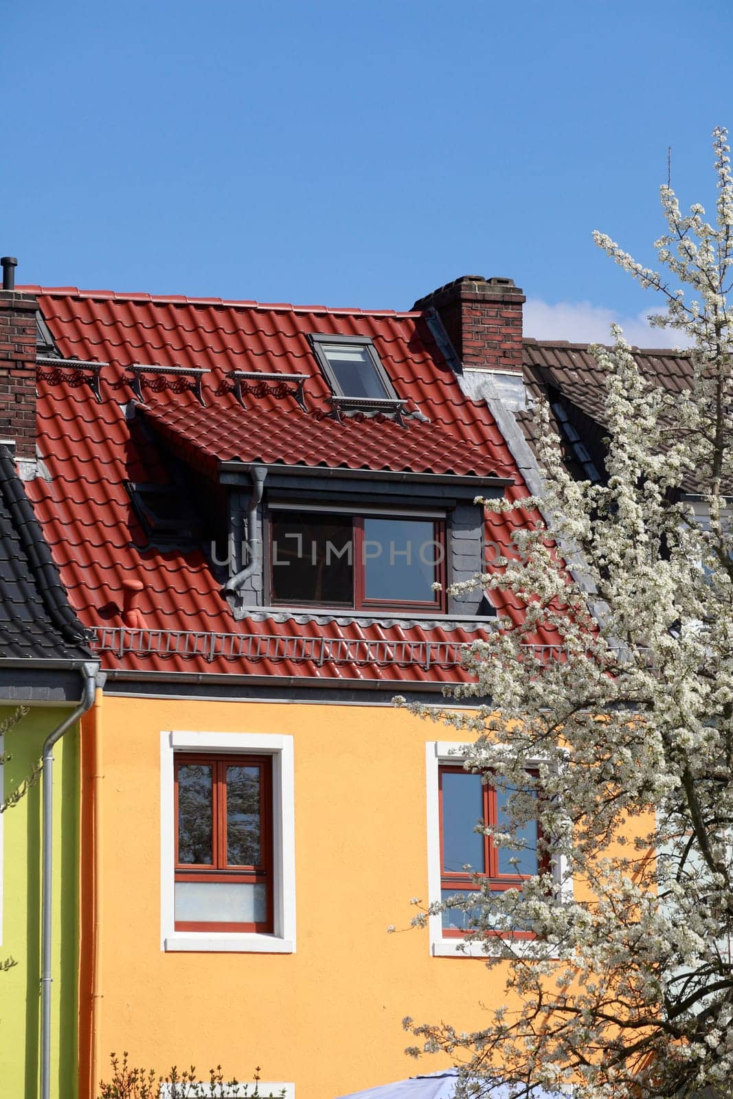 Orange residential building in spring, Bremen, Germany
