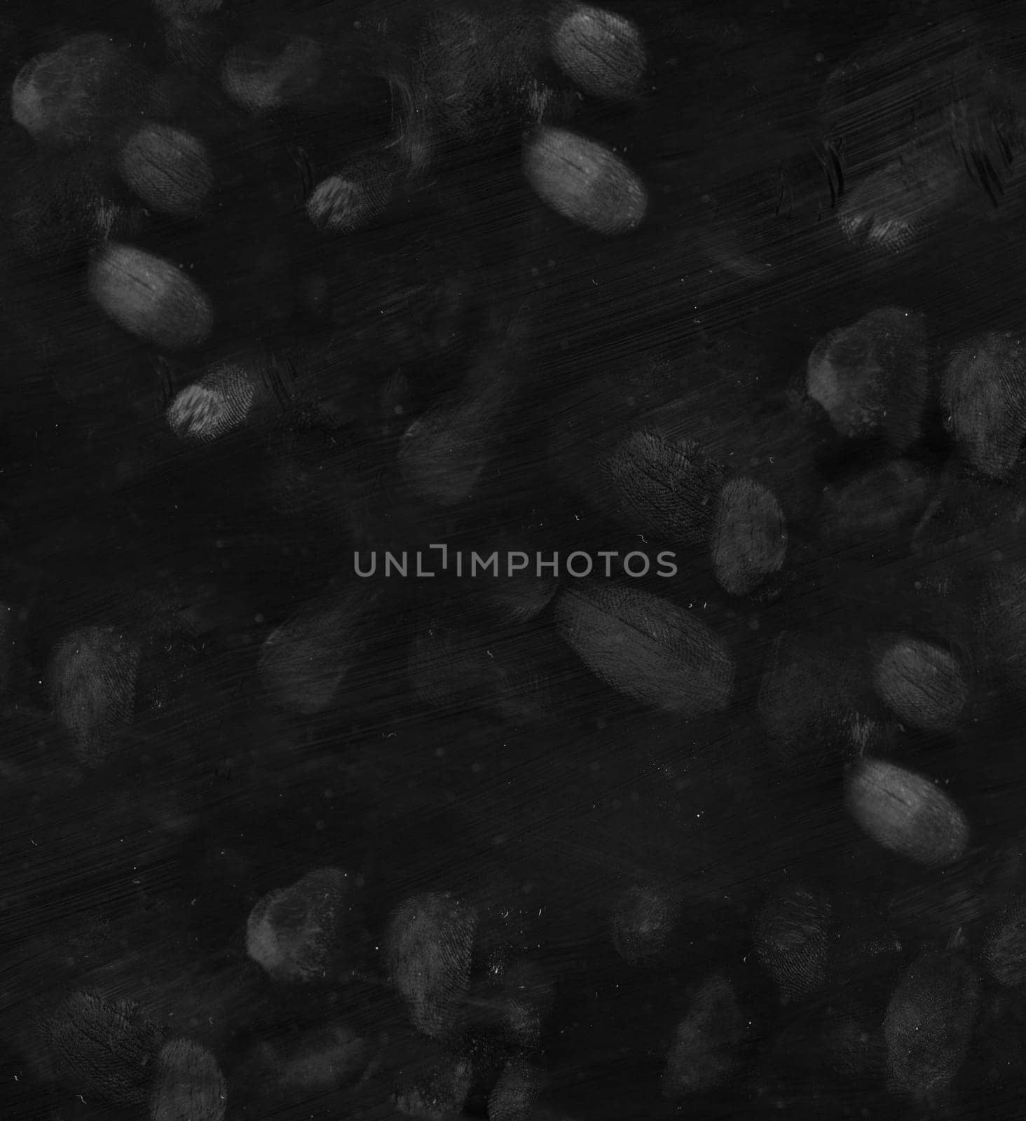 There are a lot of fingerprints on a black background.Texture or background