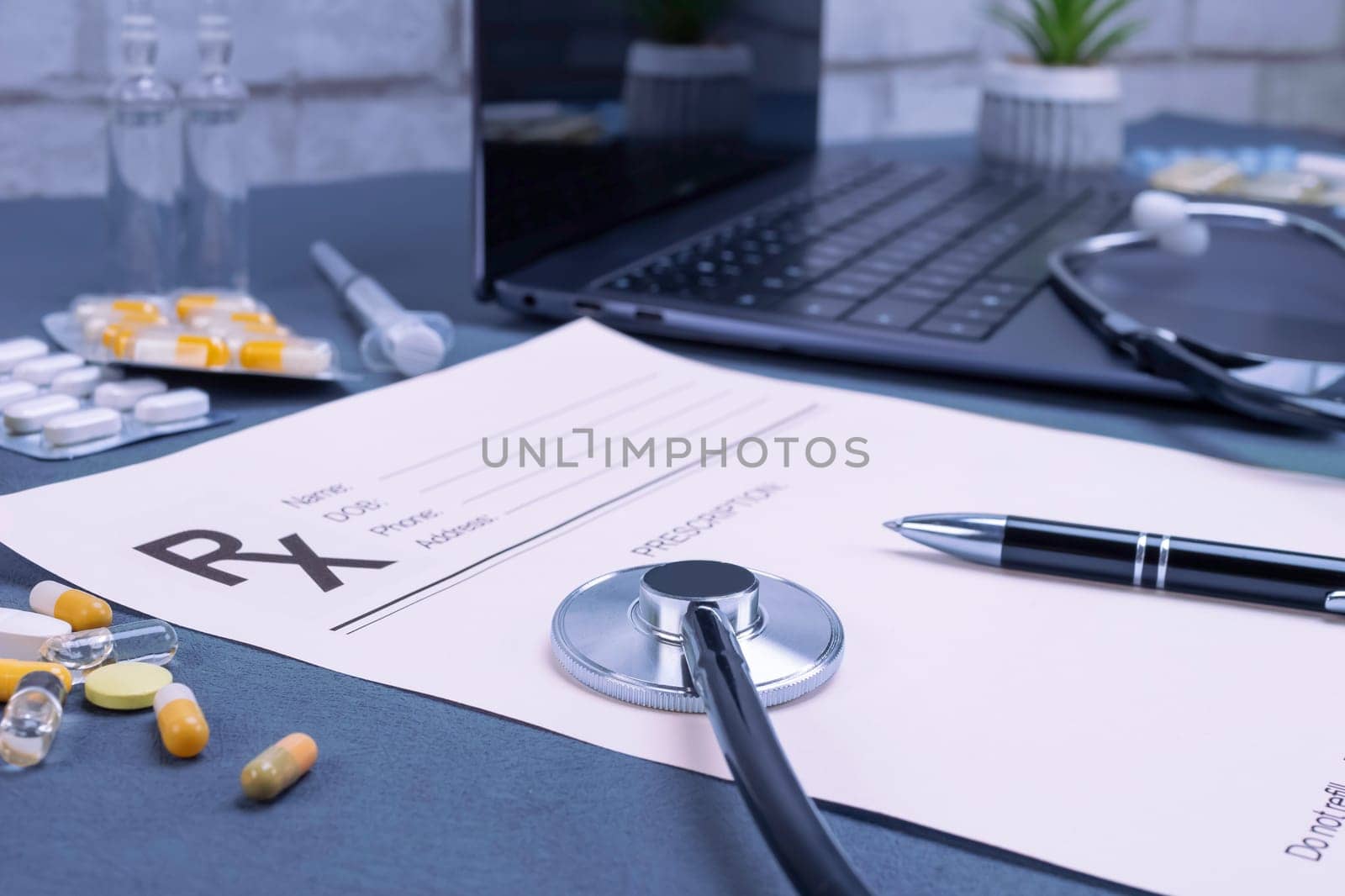 Prescription with laptop, stethoscope and pills on table. Doctor recommendation, medical exam, healthcare, doctor workplace concept