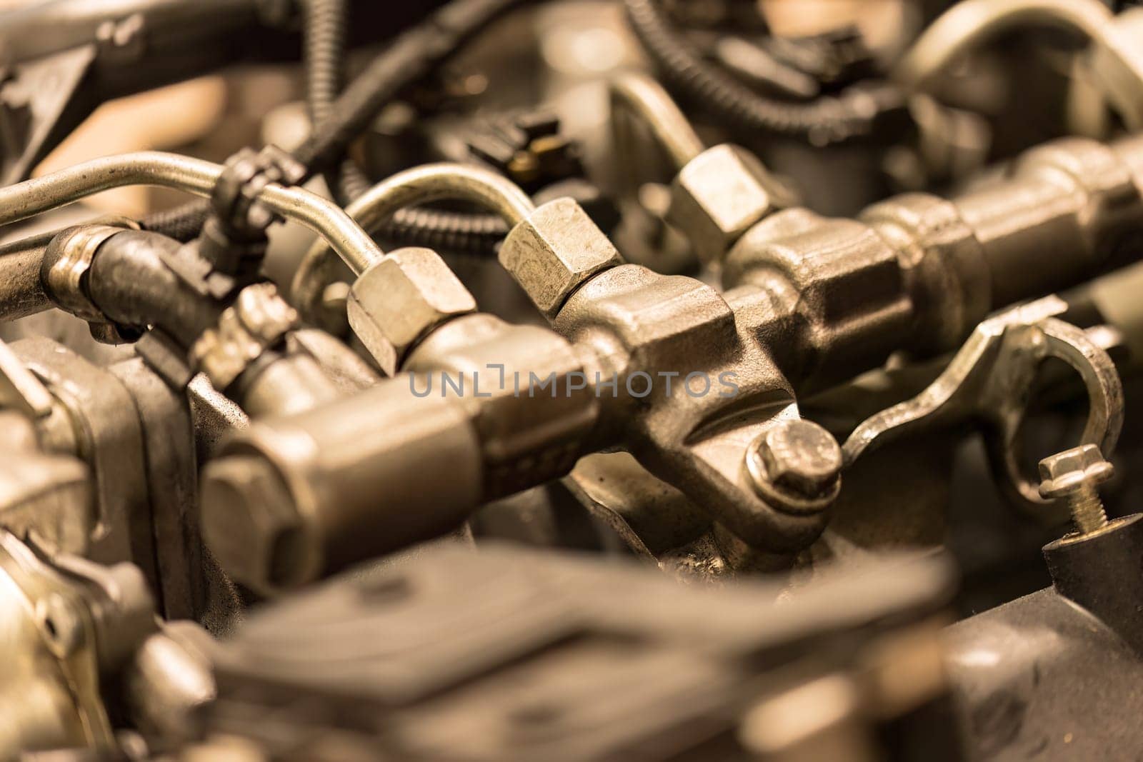 Close-up photo of common rail diesel injectors, highlighting the intricate components of fuel injection.