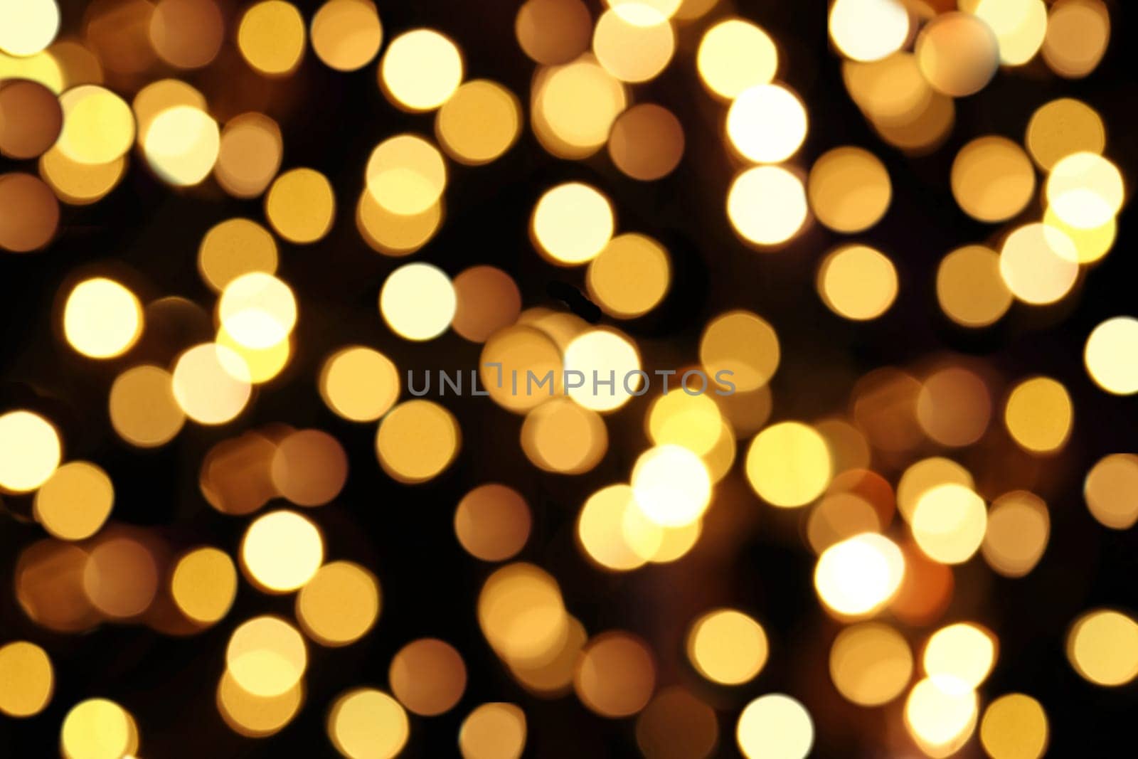 Yellow and gold background with dots of light