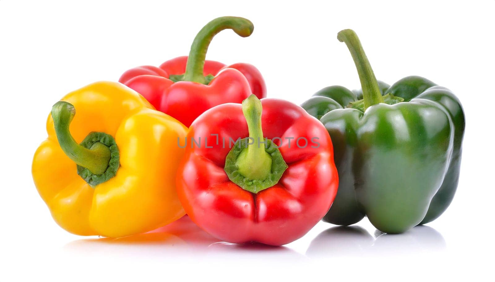 Red, green and yellow bell peppers isolated on white background. AI generated