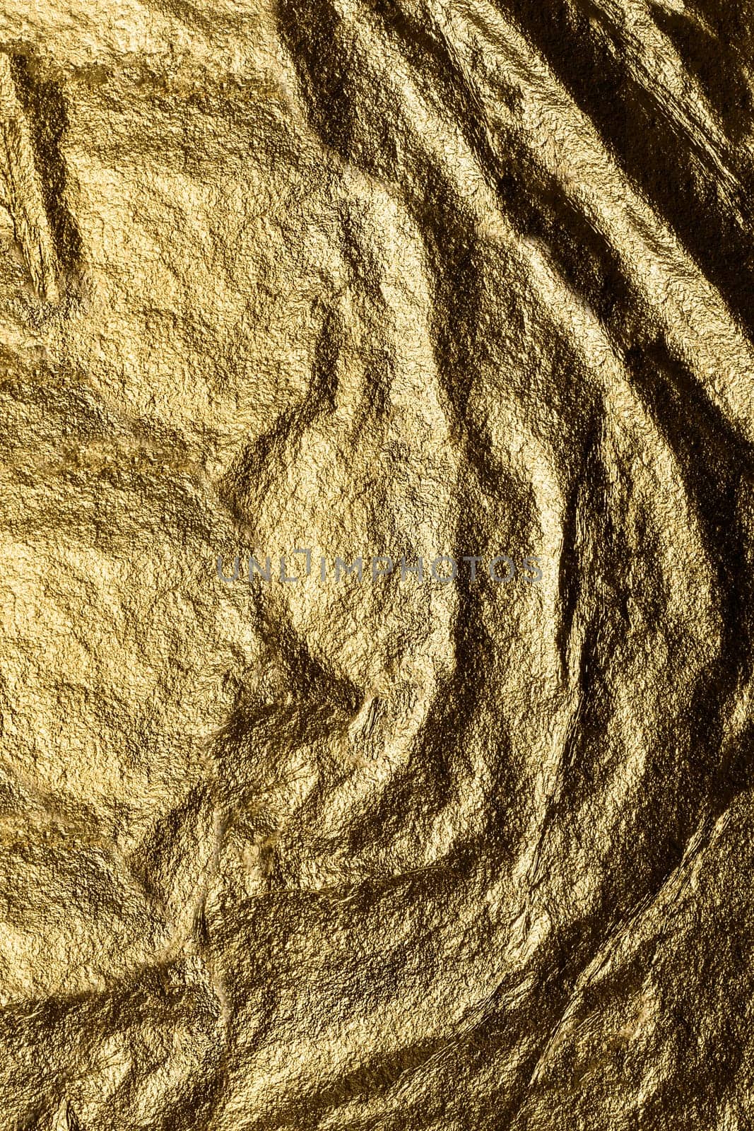 Texture or background. Background image heavily crumpled texture of gold foil