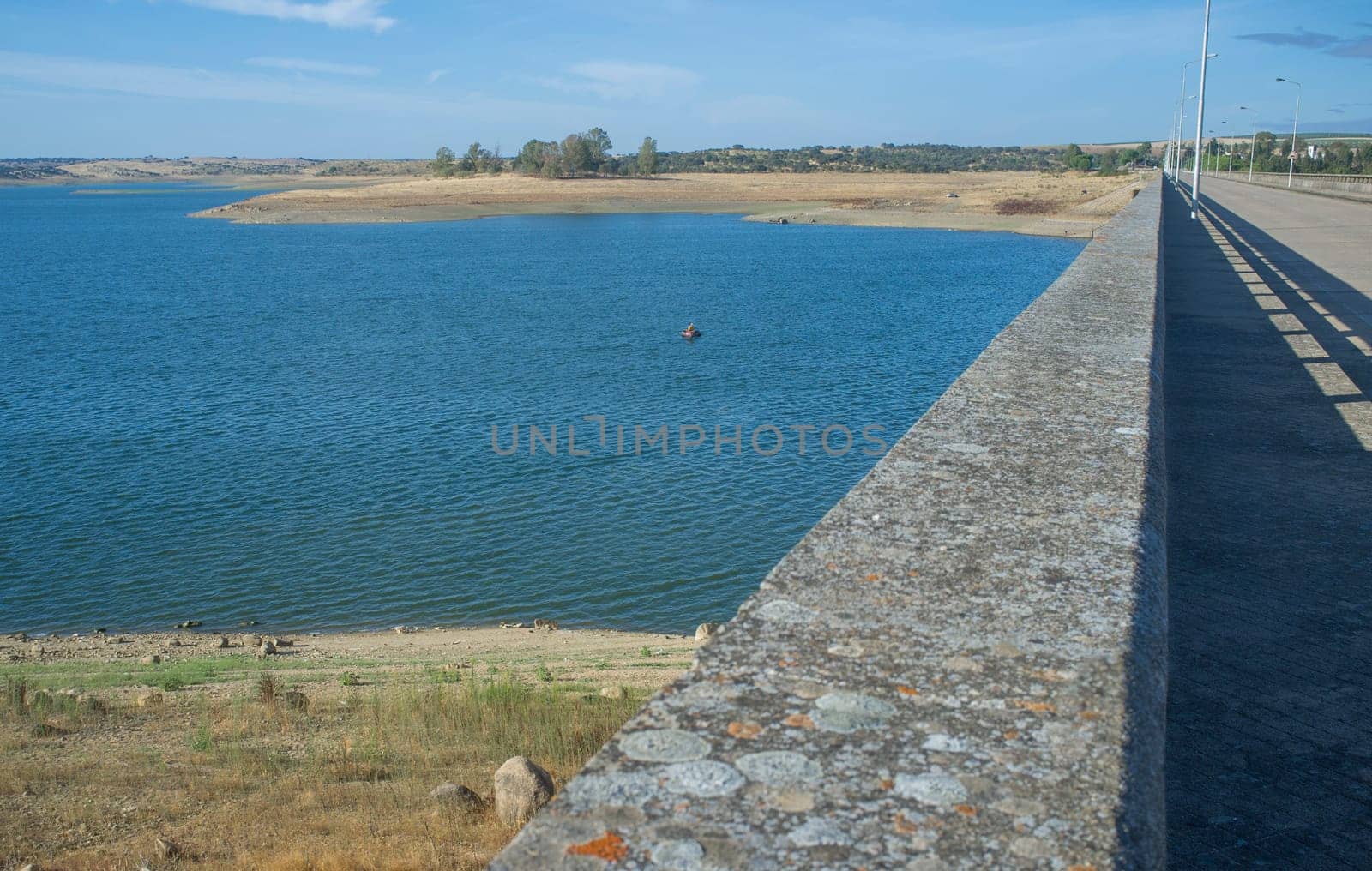 Float tube fisher close to Barragem do Caia wall, Campo Maior, Alentejo, Portugal