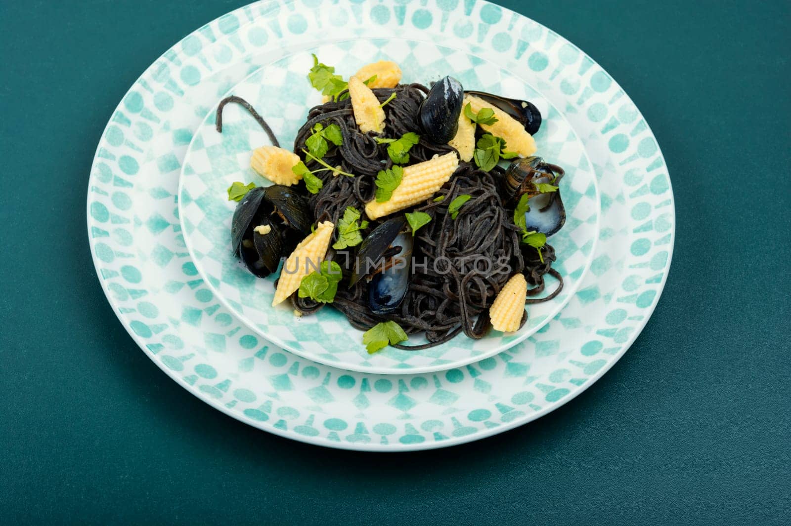 Vegan black bean pasta with clams, mussels. Mediterranean pasta vongole.